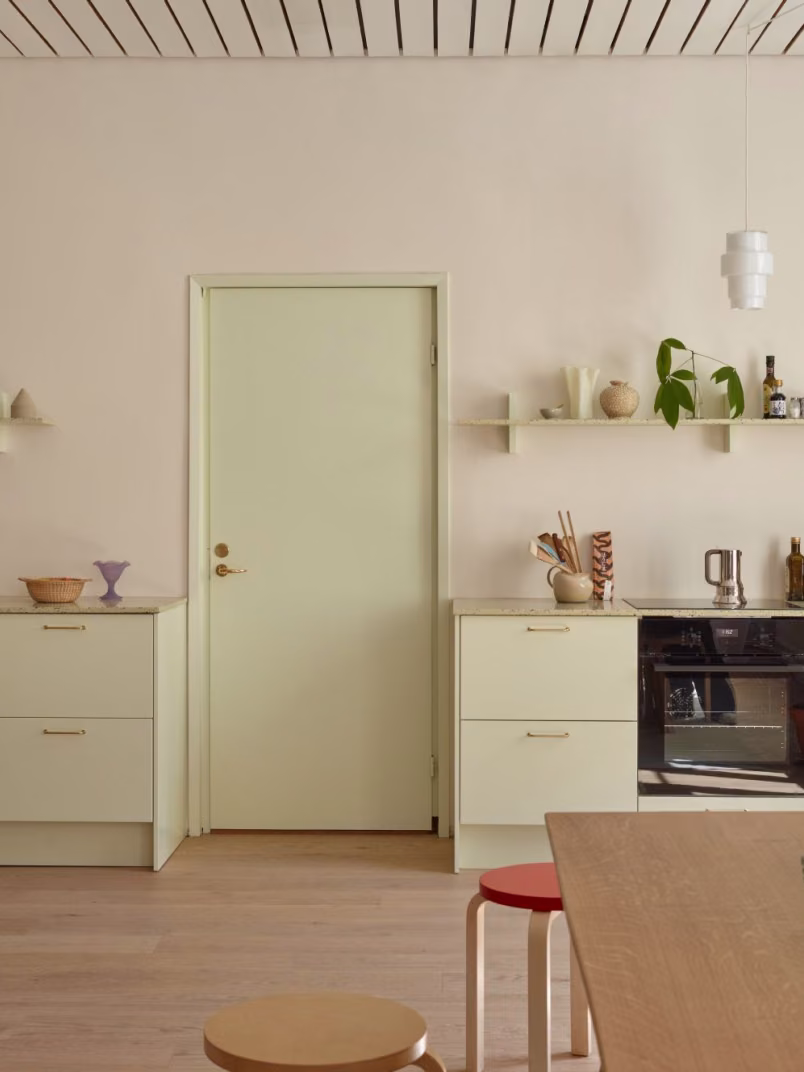 beige colour wall and muted colour interior elements in design studio