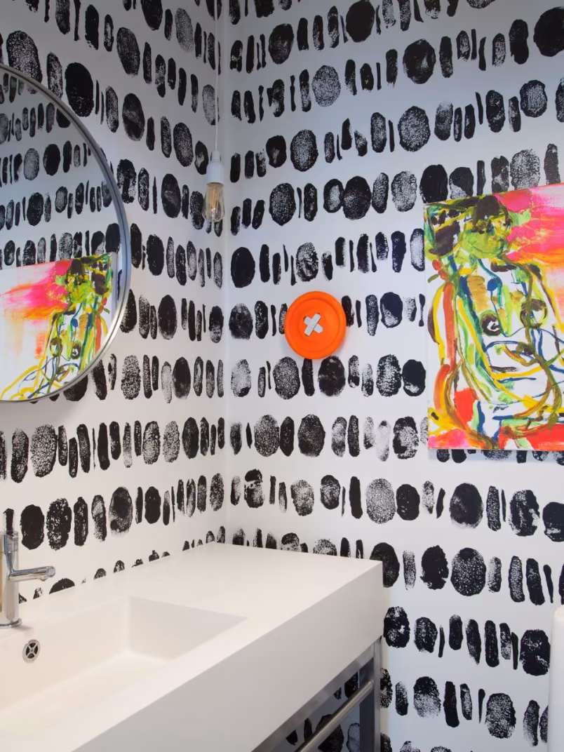 black-and-white decorative pattern on the walls of guest WC