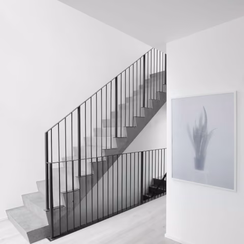 How do paints and coatings affect indoor air quality in green buildings?
